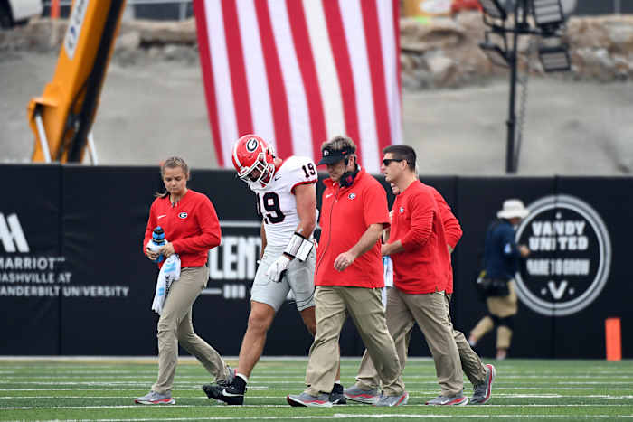 Oct 14, 2023; Nashville, Tennessee, USA; Georgia Bulldogs tight end Brock Bowers (19) walks off the field after an injury during the first half against the Vanderbilt Commodores at FirstBank Stadium. Mandatory Credit: Christopher Hanewinckel-USA TODAY Sports